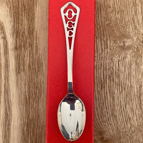 What is the significance of a silver spoon?