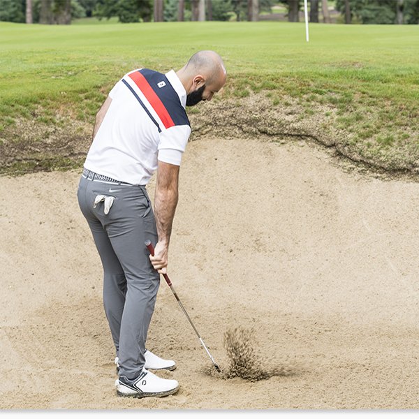 Golfer Illegally Touching Sand in the Bunker
